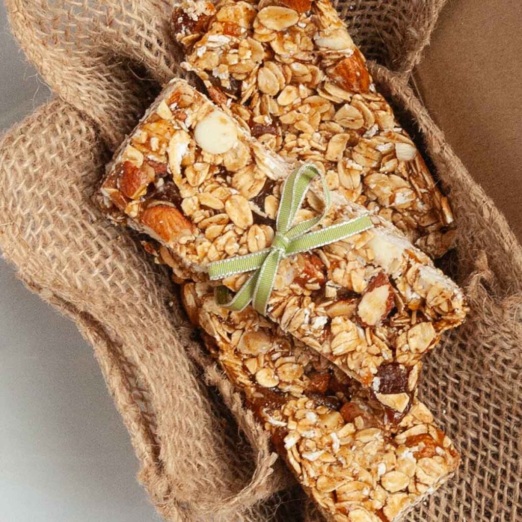 Three homemade granola bars in a box.