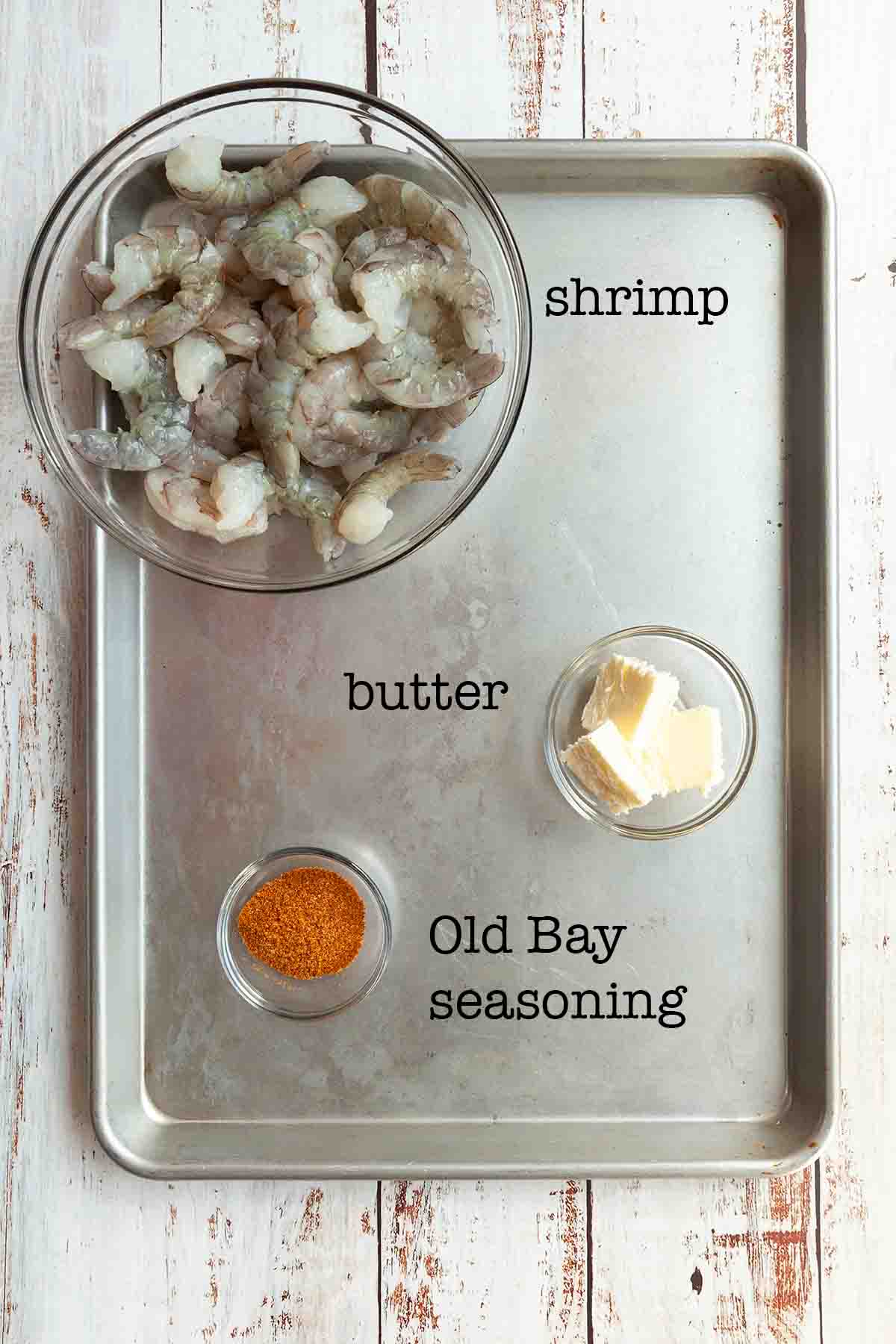 Ingredients for Old Bay shrimp--shrimp, butter, and Old Bay seasoning.