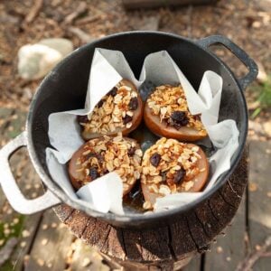 Four stuffed pears in a cast iron Dutch oven.