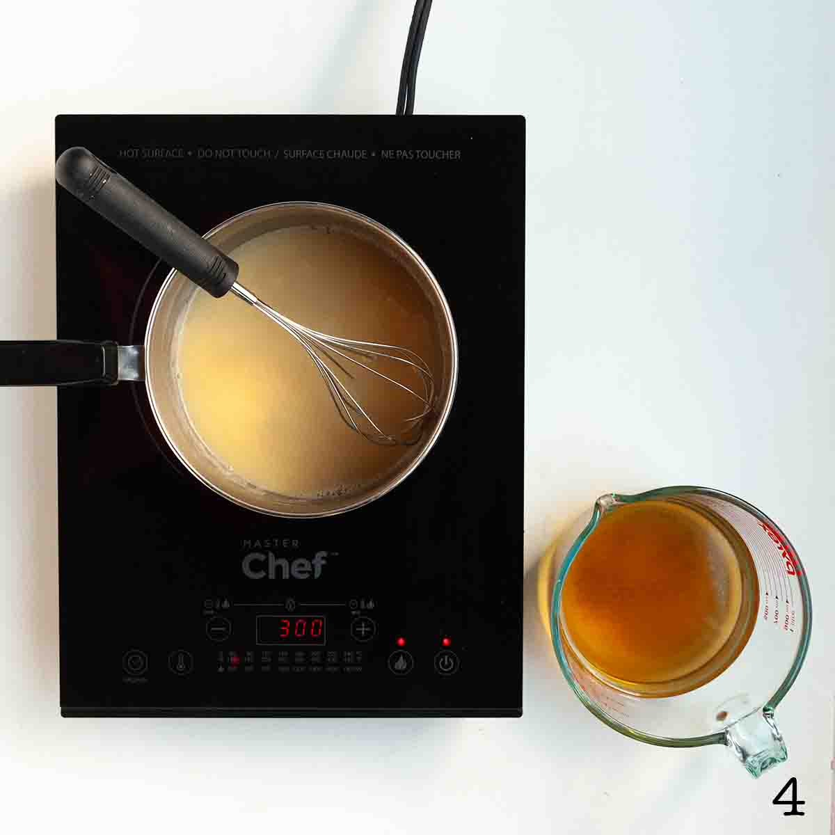 Turkey stock and gravy in a pot.