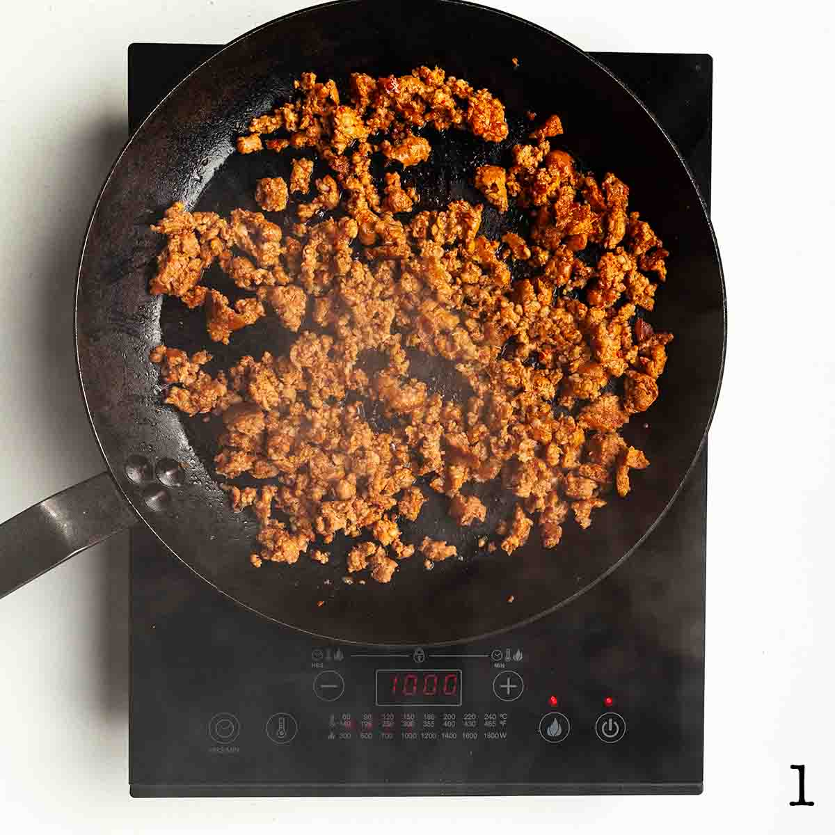 Cooked chorizo sausage in a cast iron skillet.
