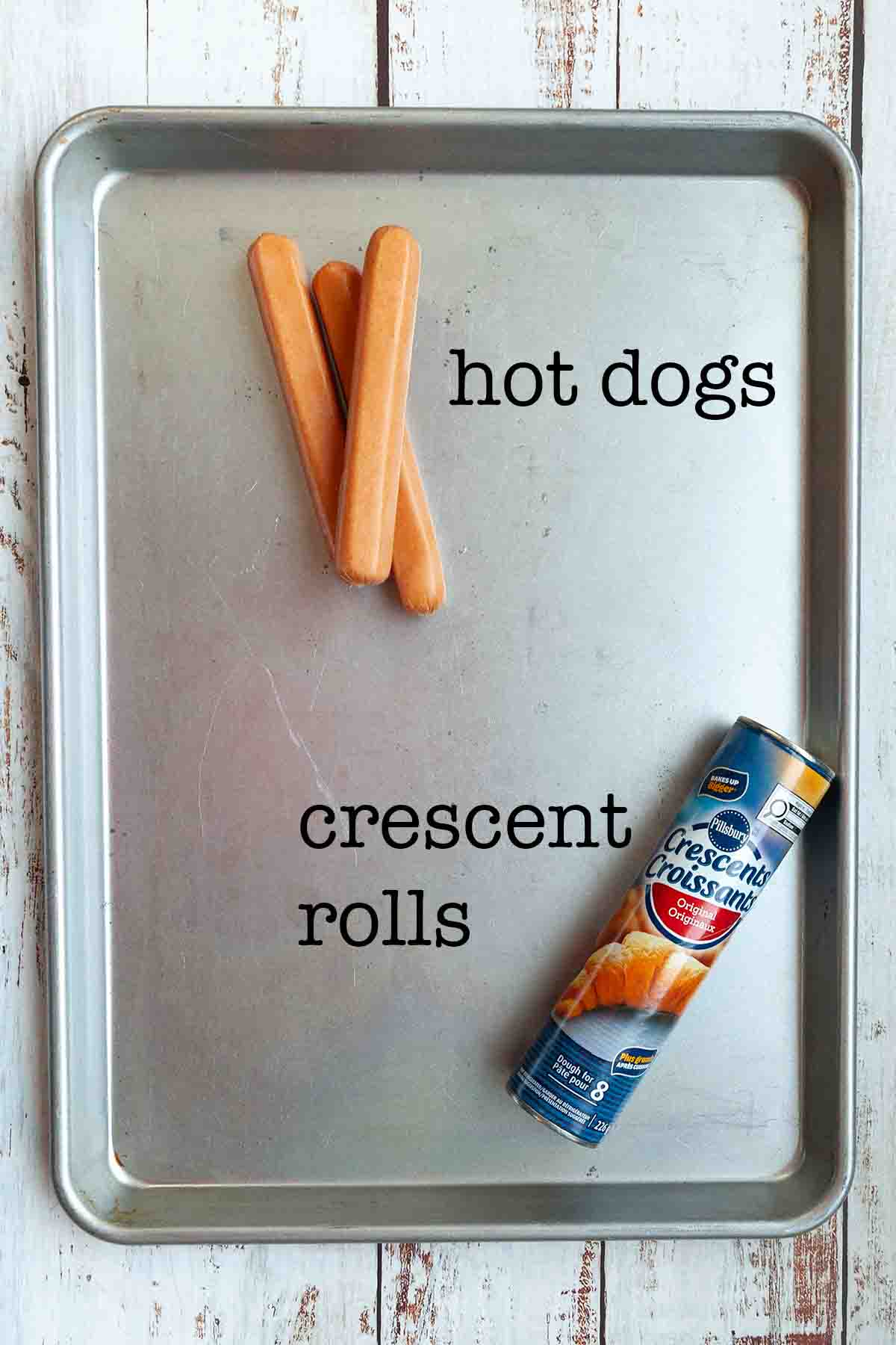 Ingredients for crescent roll campfire dogs--hot dogs and a tube of refrigerated crescent roll dough.