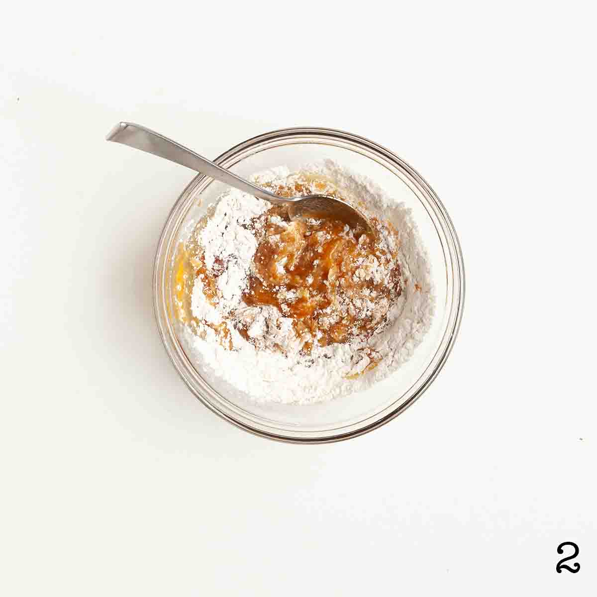 Dry ingredients mixed into wet in a bowl.