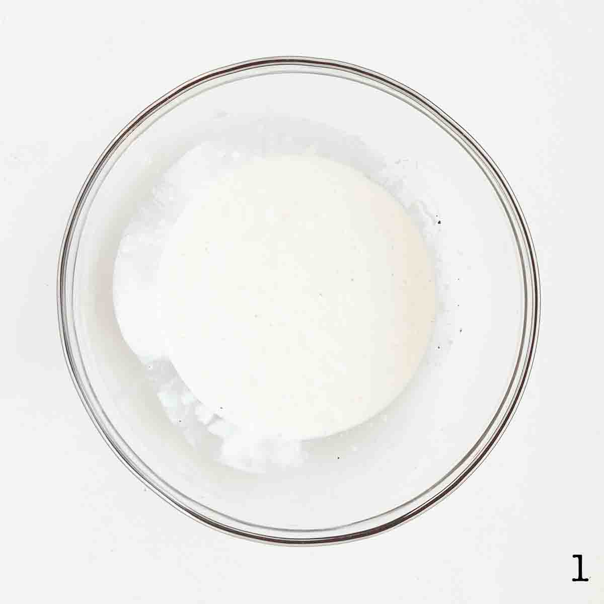 A bowl of creamy salad dressing.