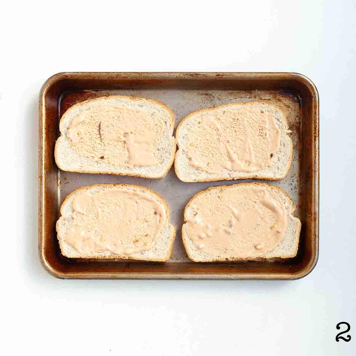 Four slices of bread spread with thousand island.