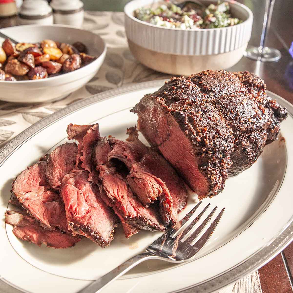 A partially sliced sirloin tip roast.