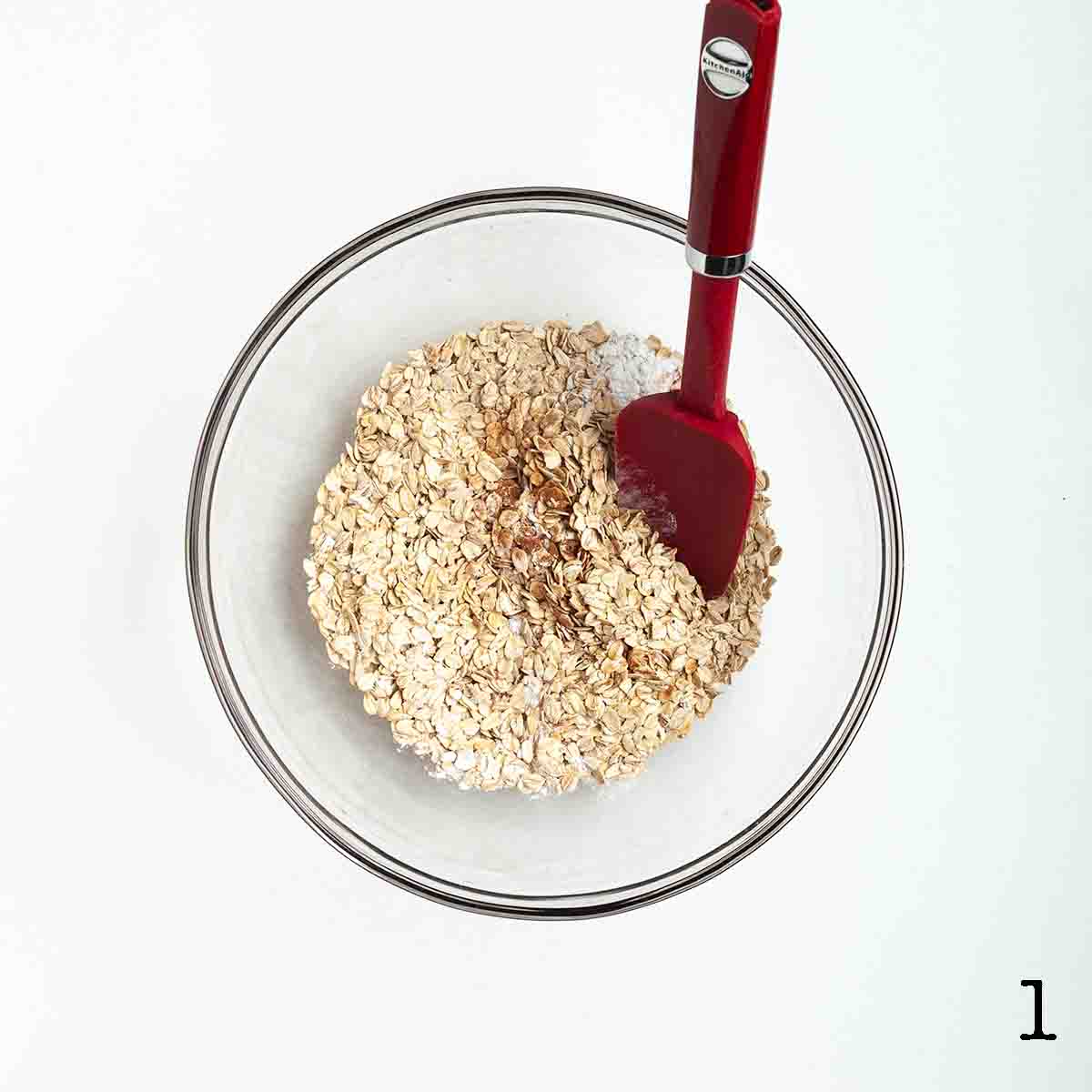 A bowl of dried oats and spices.
