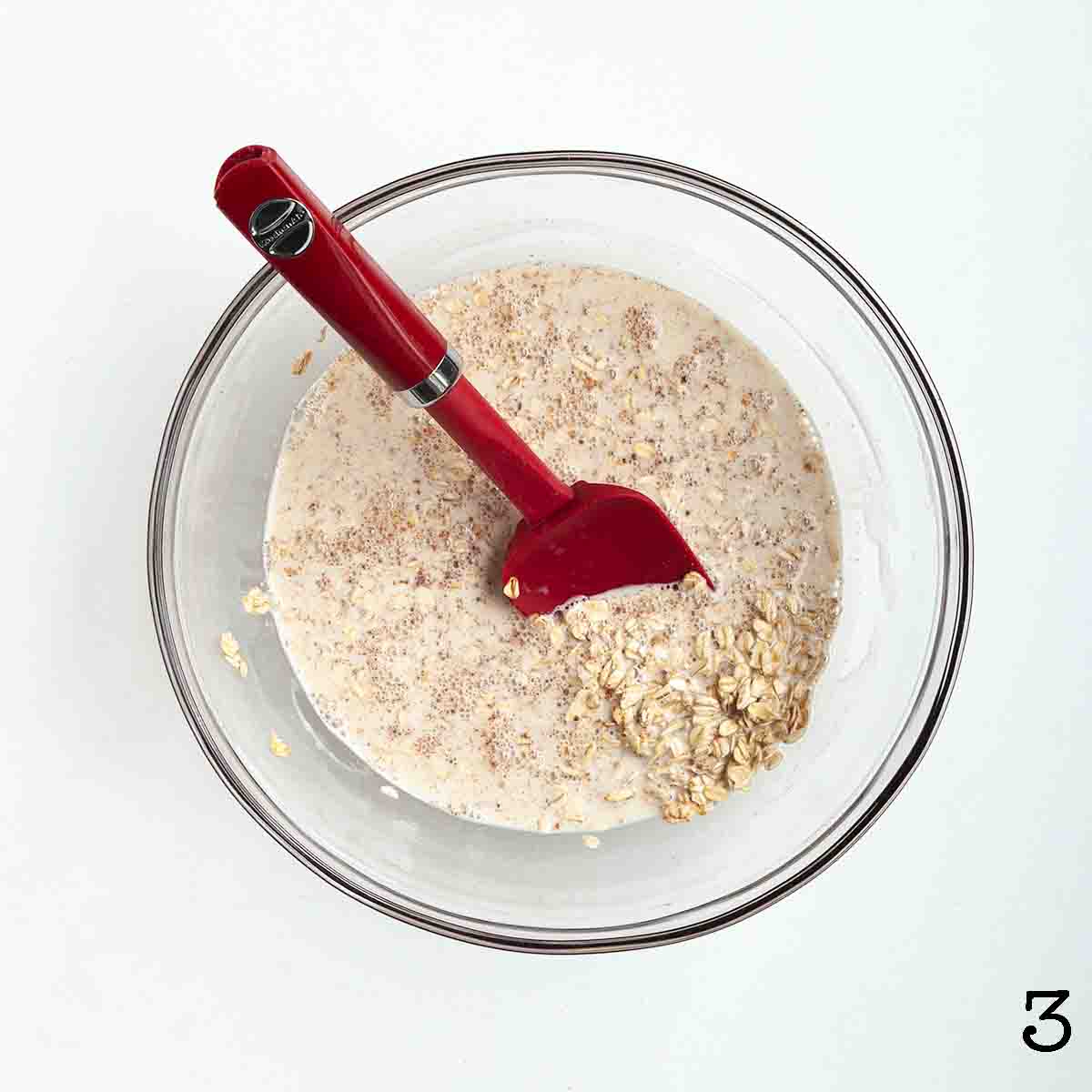 A wet oat mixture in a bowl.
