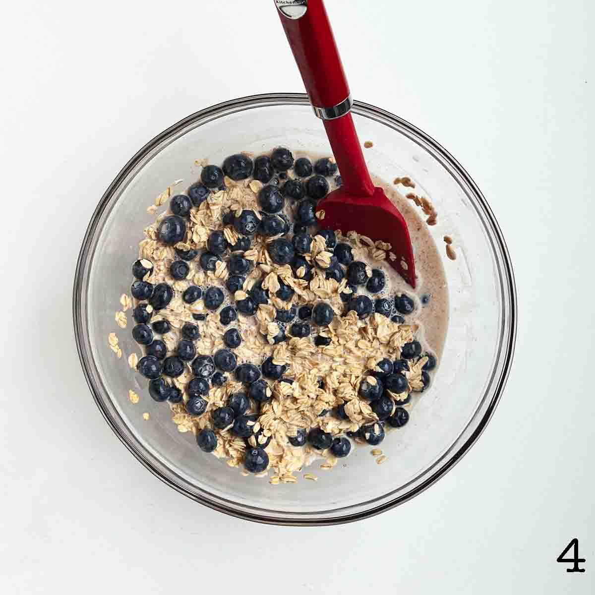 A wet oat mixture with blueberries added in.