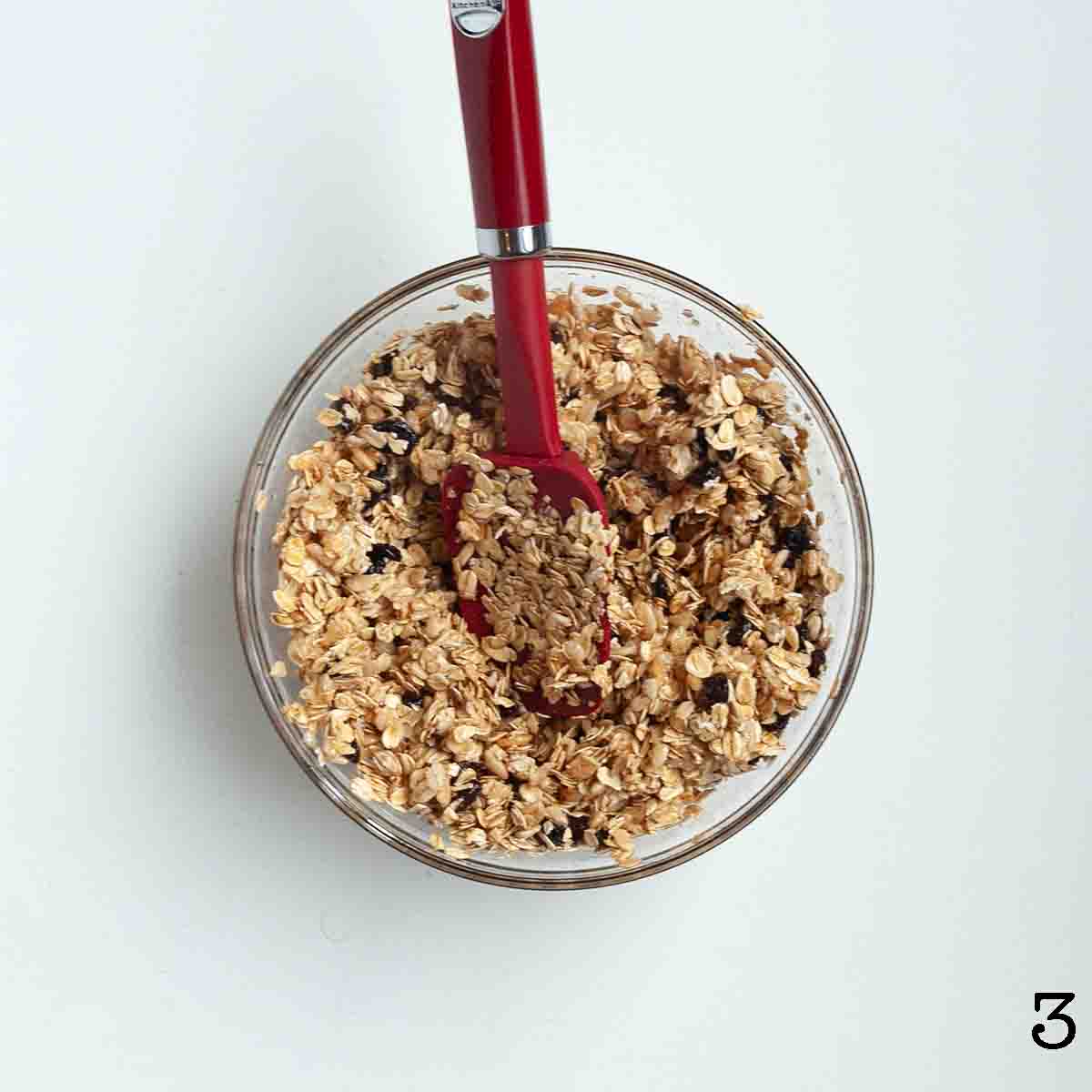 A sticky oatmeal raisin mixture in a bowl.