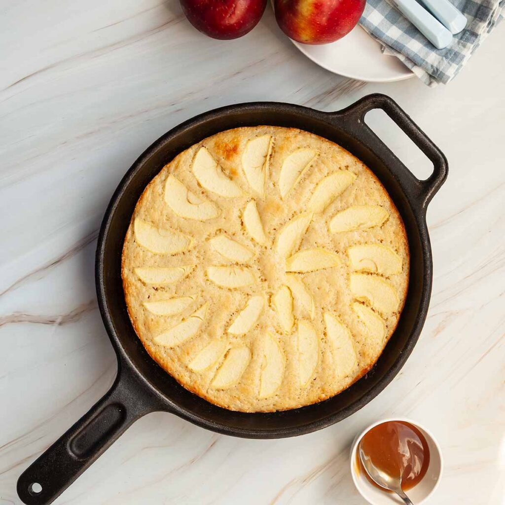 An apple cake cooked in a skillet.