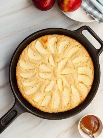 An apple cake cooked in a skillet.