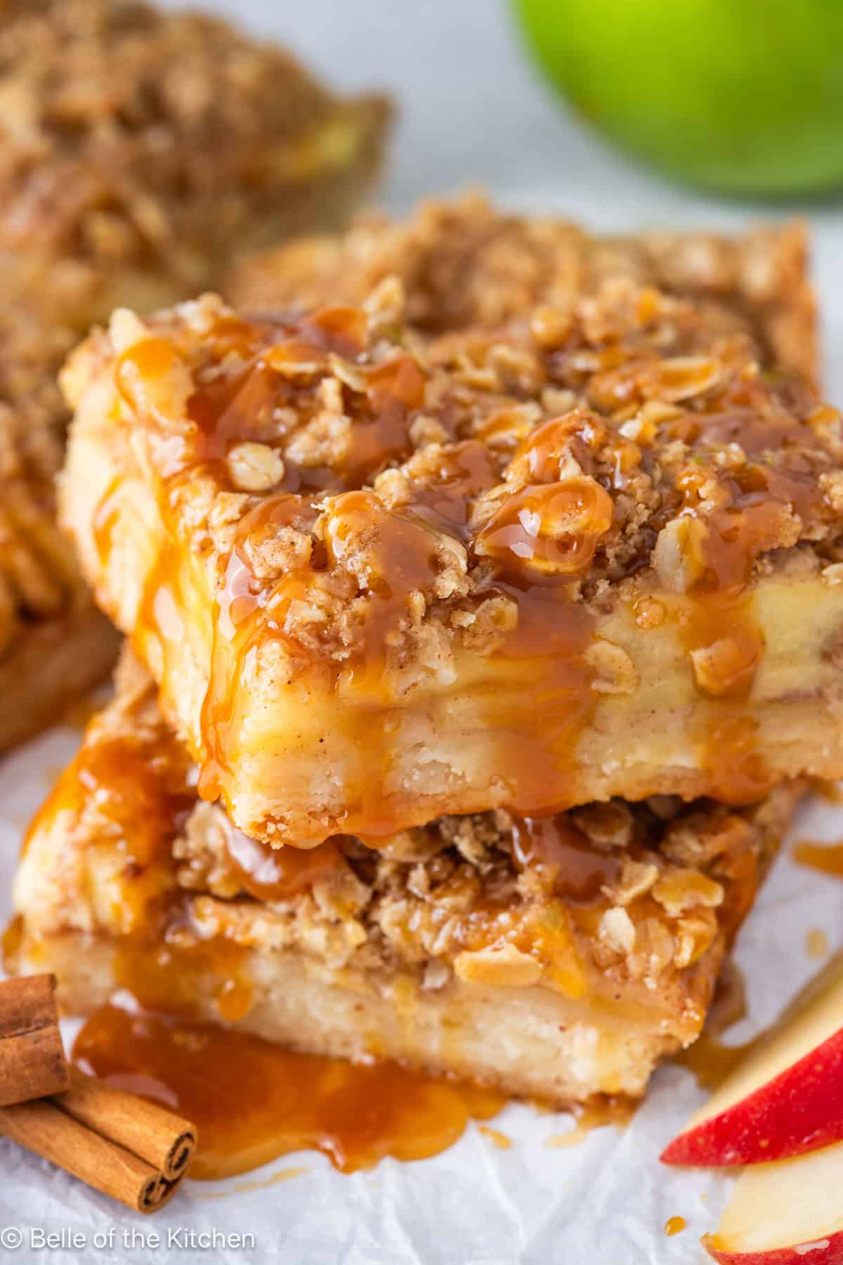 An apple pie bar drizzled with caramel.