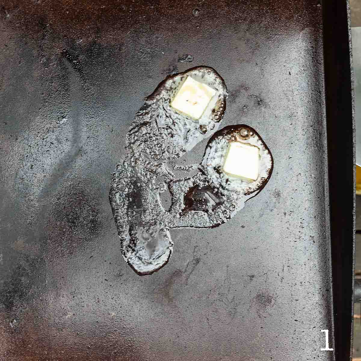 Butter melting on a griddle.